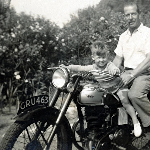 Father & son on a 1950s BSA motorcycle