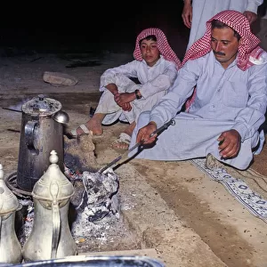 Father and son in Bedouin tent, Syria