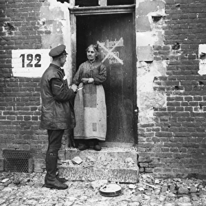 Frenchwoman at her door, Bouchain, France, WW1
