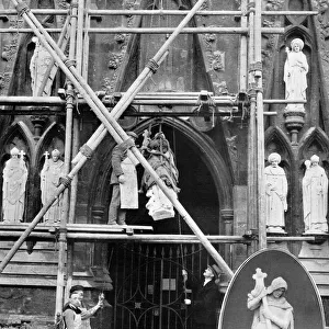 A gift to Exeter Cathedral - statues being hoisted into plac