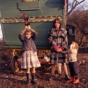 Gipsy family outside their caravan