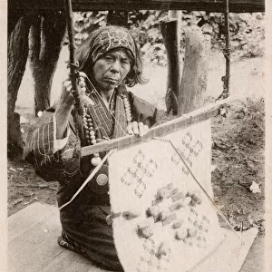 Japan - Ainu woman weaving