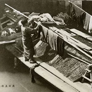 Japanese barge-dweller hanging out her laundry