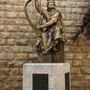 King David of Israel (C. 1040-970 BC) playing the harp. Stat