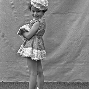 Little girl posing in a short dress