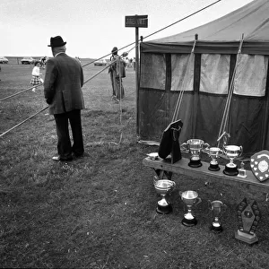 Man outside the judges tent during a Highland Games event