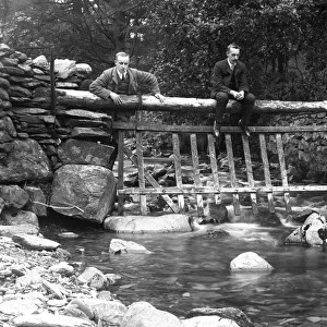 Two men on a bridge at Tilberthwaite in the Lake District