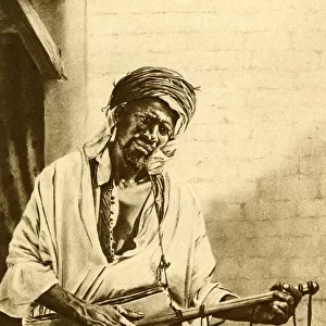 Musician with guitar, Algeria, North Africa
