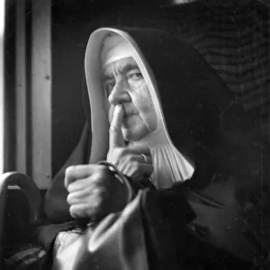 Nun looking at the camera