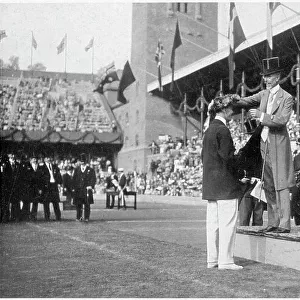 Presentation of medals to the 100 metre men. Date: 1912