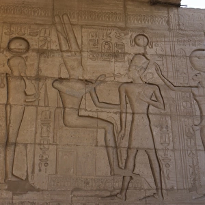 Relief depicting a Pharaoh Ramses II before gods Amun, Ptah