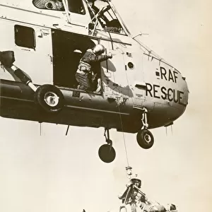 A Royal Air Force Westland Whirlwind winching a stretcher