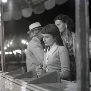 Sad-looking girl at the fair