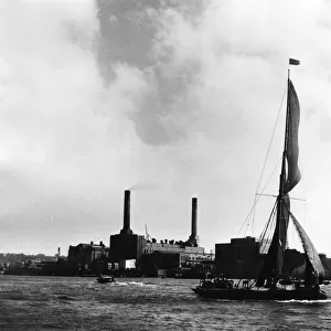 A sailing barge passing up Greenwich Reach, on the River Thames, London, England