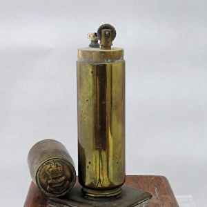 Second World War Trench Art lighter on wooden plinth