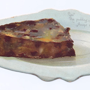 Slice of pudding on a plate on a shaped Christmas card