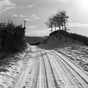 A snow-covered country lane