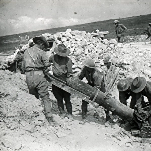 Soldiers loading a field gun