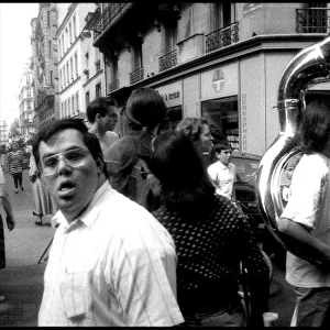 Street musician in crowd, Paris, France