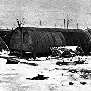 Weatherproof winter field-barracks: snowy Nissen huts, 1917