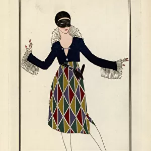 Woman in harlequin costume and mask for a fancy dress ball