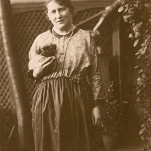 Woman and puppy in a garden