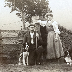 A woman, two shepherds and three sheepdogs