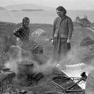 Two women with smoking brazier, Isle of Harris, Scotland
