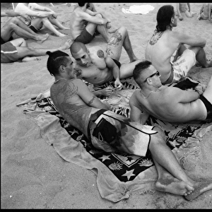 Young men on beach - Marina di Pisa, Italy