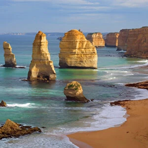 Twelve Apostles - morning at the sandstone rock formations of famous Twelve Apostels, which are sculpted by the relentless sea. The force of the sea eats more and more of the rocks away