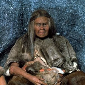 Model of a neanderthal woman holding a baby