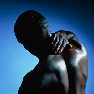 Neck / shoulder pain: black man with hand on neck