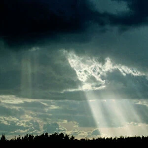 Suns rays breaking through clouds