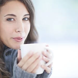 Woman with hot drink F006 / 2630
