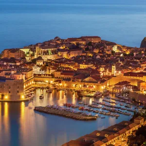 Aerial view of Old Port and Dubrovnik Old Town at night, UNESCO World Heritage Site