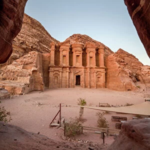 Al Deir (Monastery) monument at sunset, carved into the mountain side and framed by a cave, Petra, UNESCO World Heritage Site, Jordan, Middle East