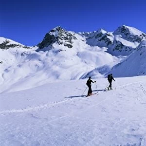 Alpine ski tourers start from Muottas Muragl at 2453m