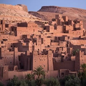 The ancient mud brick buildings of Kasbah Ait Benhaddou bathed in golden morning light