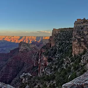 Angel's Window at Cape Royal on North Rim above Unker Creek near sundown, with smoke from a wildfire creating brown haze on the horizon, Gand Canyon National Park, UNESCO World Heritage Site, Arizona, United States of America, North America