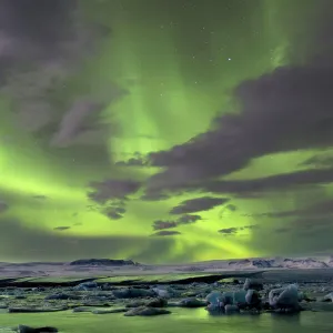 The Aurora Borealis (Northern Lights) captured in the night sky over Jokulsarlon glacial lagoon on the edge of the Vatnajokull National Park, during winter, South Iceland, Iceland, Polar Regions