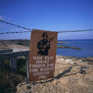 Barbed wire and forbidden zone sign of Turkish Military zone, common following 20 July 1974 invasion, near Lapta, Lambousa, North