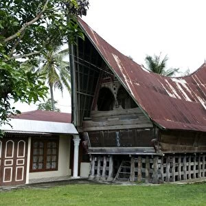 Batak Toba tribal rural village houses with contemporary extensions on Samosir Island in Lake Toba, Sumatra, Indonesia, Southeast Asia, Asia