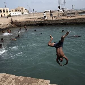 Children play in an ocean pool, Massawa, Red Sea, Eritrea, Africa