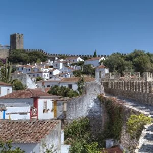 City overview with Wall and Medieval Castle in the background, Obidos, Portugal, Europe