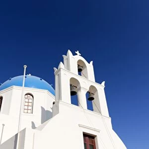 Classic Greek Orthodox church with blue dome, Oia, Santorini, Cyclades, Greek Islands