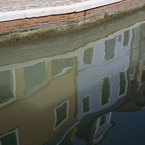 Colourful buildings and reflections in canal