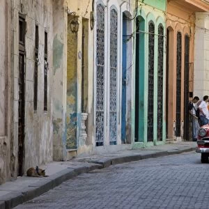 Colourful street with traditional old American car parked, Old Havana, Cuba