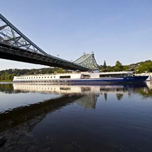 Cruise ship beneath a bridge over the River Elbe near Dresden, Saxony, Germany, Europe