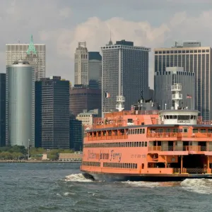 The famous orange Staten Island Ferry approaches lower Manhattan, New York