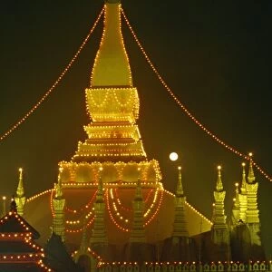 Lights illuminate the Great Stupa of Pha That Luang